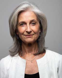 Woman with shoulder-length gray hair