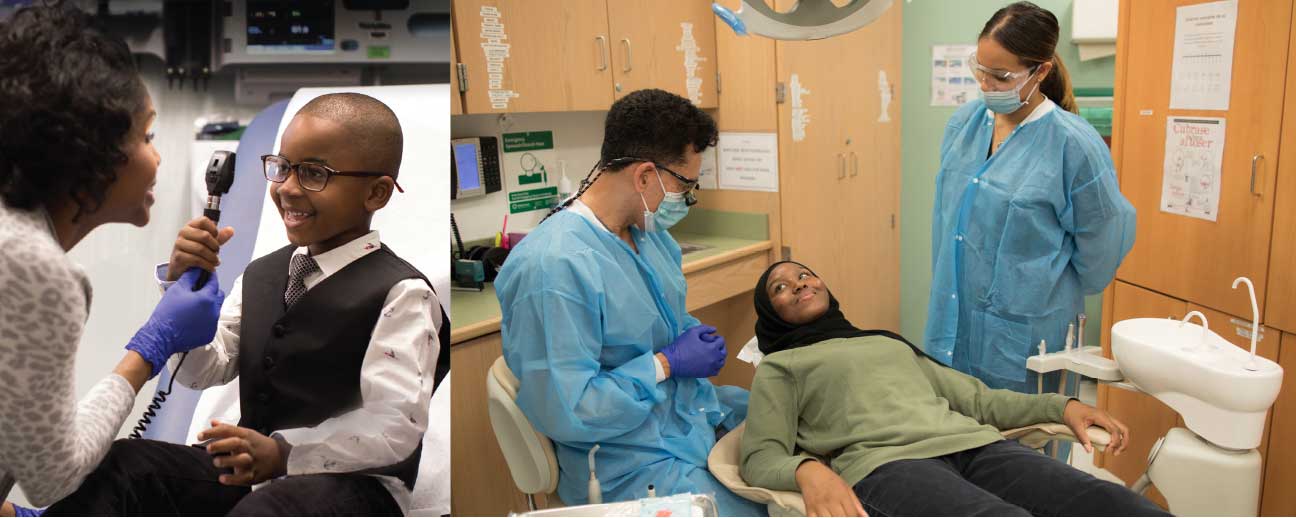 Girl in black scarf and green sweater lays in dental chair and looks up at dentist wearing blue respiratory mask and blue coat as woman in blue mask and blue coat looks on.